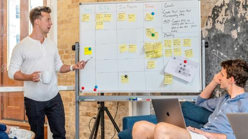A leader or manager provides guidance to their team in a meeting.